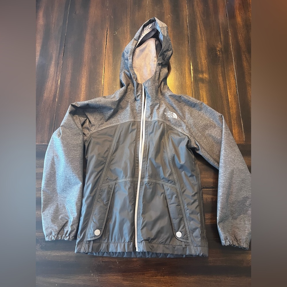 Girls youth The North Face Dryvent lined rain jacket.